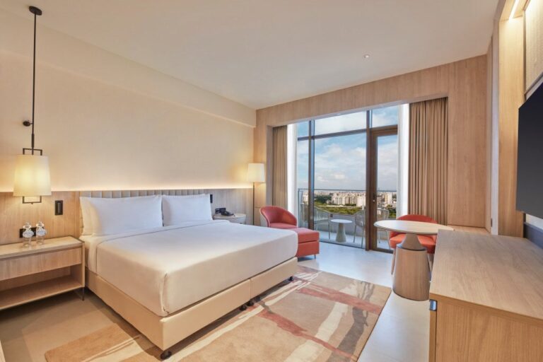 Hilton Gurugram Baani City Centre - City Scape with Balcony Guest Room, bed, chair, desk, window