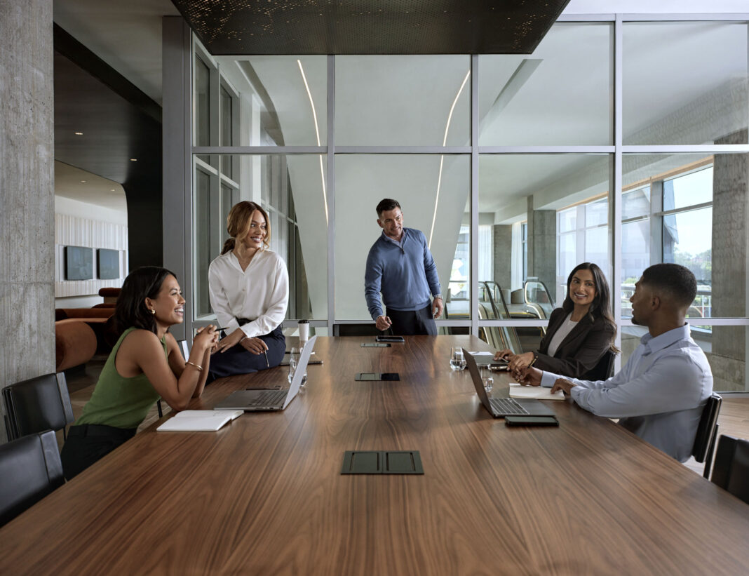 Signia by Hilton Atlanta, Meeting Space, work meeting, conference room, laptops, group laughing, conference table